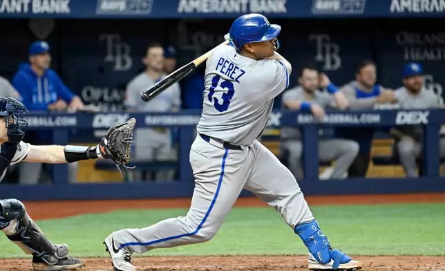 Kansas City Royals' Salvador Perez hits a two-RBI single during the eighth inning of a baseball game against the Tampa Bay Rays Tuesday, June 23, 2026, in St. Petersburg, Fla. (AP Photo/Jason Behnken)