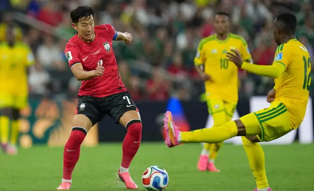South Korea's Son Heung-min (7) controls the ball against South Africa's Thapelo Maseko (12) during the World Cup Group A soccer match between South Africa and South Korea in Guadalupe, near Monterrey, Mexico, Wednesday, June 24, 2026. (AP Photo/Matias Delacroix)