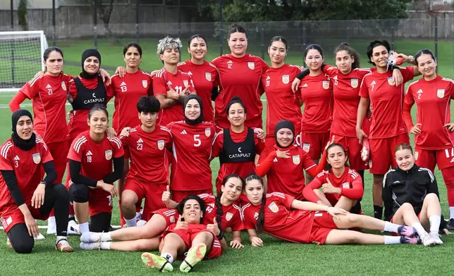 Afghan women's players pose for a team photo during a training session in Auckland, New Zealand, Tuesday, June 2, 2026. (Andrew Cornaga/Photosport via AP)