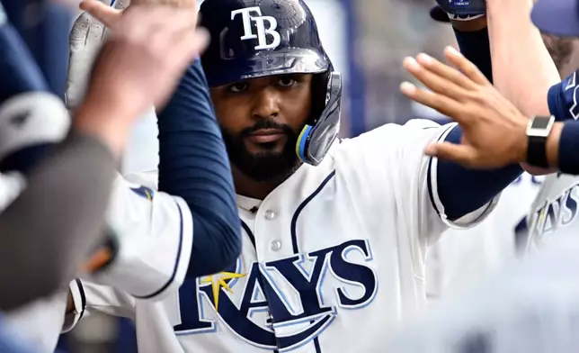 Tampa Bay Rays Junior Caminero celebrates after scoring on an RBI single by Jonathan Aranda, not pictured, during the third inning of a baseball game against the Kansas City Royals Wednesday, June 24, 2026, in St. Petersburg, Fla. (AP Photo/Jason Behnken)