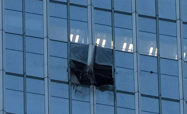 The surface of the Citic Tower also known as Zun Tower is damaged in Beijing,, Friday, June 26, 2026. (AP Photo/Han Guan Ng)