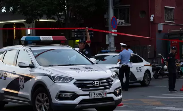 Police close off a road leading to the Citic Tower also known as Zun Tower after its facade was damaged in Beijing, Cina, Friday, June 26, 2026. (AP Photo/Han Guan Ng)