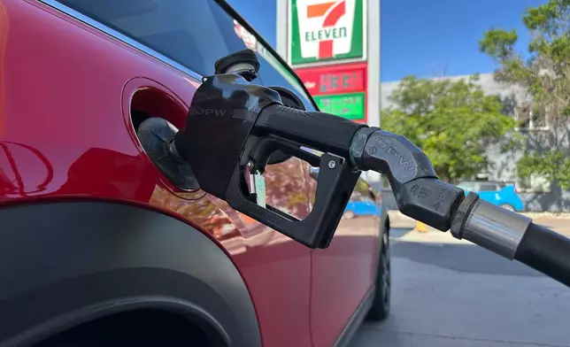 A motorist fills up the tank of a vehicle at a Conoco gasoline station Saturday, May 30, 2026, in Denver. (AP Photo/David Zalubowski)