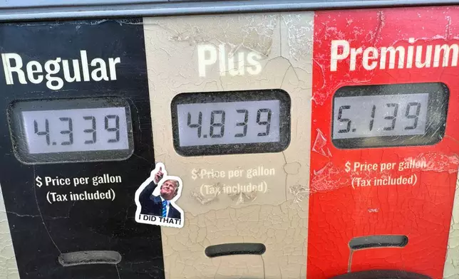 A sticker with the image of President Donald J. Trump points to the electronically-displayed per-gallon prices for the various grades of gasoline available from a pump at a Conoco station Saturday, May 30, 2026, in Denver. (AP Photo/David Zalubowski)