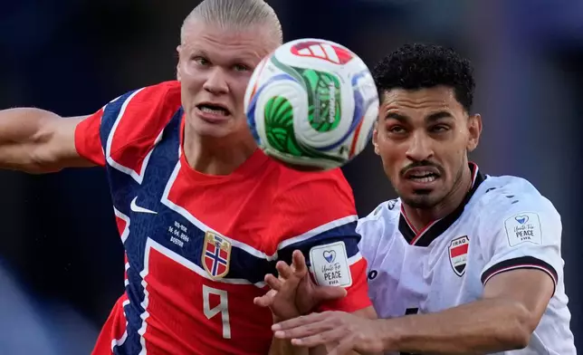 Norway's Erling Haaland (9), left, and Iraq's Zaid Tahseen (4) eye the ball during the World Cup Group I soccer match between Iraq and Norway in Foxborough, Mass., near Boston, Tuesday, June 16, 2026. (AP Photo/Charles Krupa)