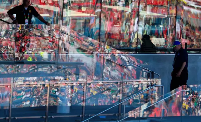 The colors of Norway and Iraq reflect in the glass during the World Cup Group I soccer match between Iraq and Norway in Foxborough, Mass., near Boston, Tuesday, June 16, 2026. (AP Photo/Mark Stockwell)