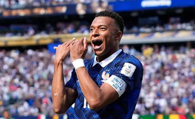 France's Kylian Mbappe celebrates after scoring the opening goal of his team during the World Cup Group I soccer match between France and Senegal in East Rutherford, N.J., near New York, Tuesday, June 16, 2026. (AP Photo/Frank Franklin II)