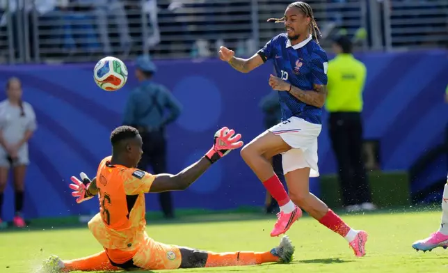 France's Bradley Barcola (12) scores his sides second goal during the World Cup Group I soccer match between France and Senegal in East Rutherford, N.J., near New York, Tuesday, June 16, 2026. (AP Photo/Steve Luciano)