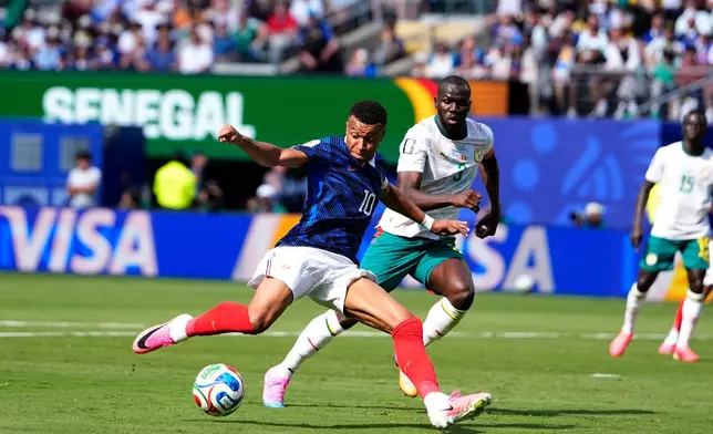 France's Kylian Mbappe scores the opening goal of his team during the World Cup Group I soccer match between France and Senegal in East Rutherford, N.J., near New York, Tuesday, June 16, 2026. (AP Photo/Frank Franklin II)
