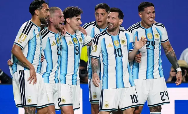 Argentina's Lionel Messi, second right, celebrates with teammates after scoring his team's second goal during the World Cup Group J soccer match between Argentina and Algeria in Kansas City, Mo., Tuesday, June 16, 2026. (AP Photo/Charlie Riedel)