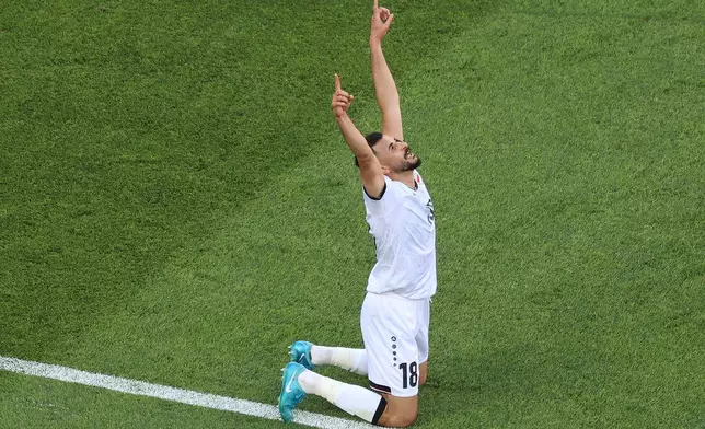 Iraq's Aymen Hussein (18) celebrates after scoring his side's opening goal during the World Cup Group I soccer match between Iraq and Norway in Foxborough, Mass., near Boston, Tuesday, June 16, 2026. (AP Photo/Mark Stockwell)