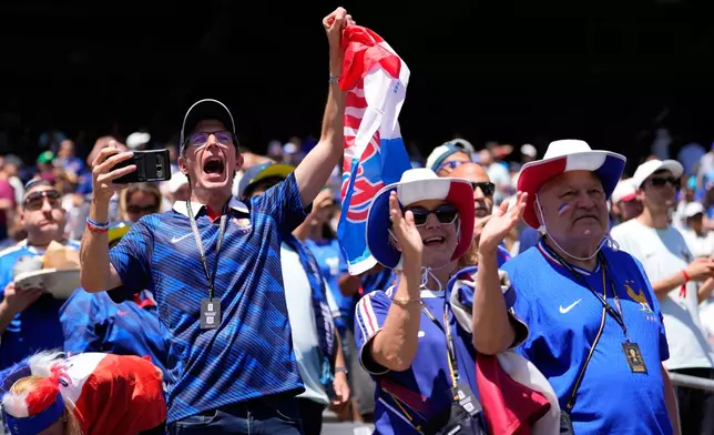 France fans on the stands wait for the start of the World Cup Group I soccer match between France and Senegal in East Rutherford, N.J., near New York, Tuesday, June 16, 2026. (AP Photo/Yuki Iwamura)