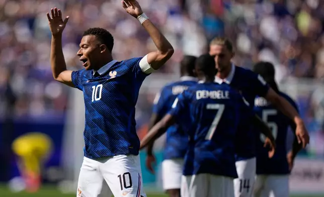 France's Kylian Mbappe celebrates after scoring the opening goal of his team during the World Cup Group I soccer match between France and Senegal in East Rutherford, N.J., near New York, Tuesday, June 16, 2026. (AP Photo/Frank Franklin II)