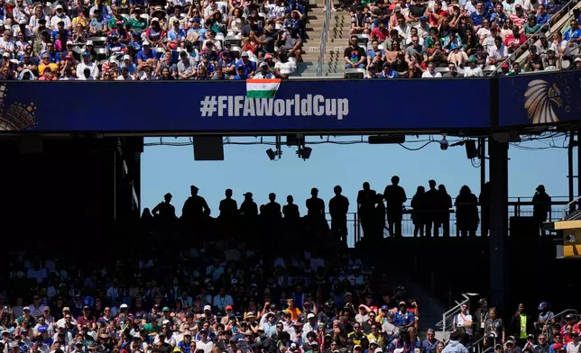 Spectators watch the World Cup Group I soccer match between France and Senegal in East Rutherford, N.J., near New York, Tuesday, June 16, 2026. (AP Photo/Frank Franklin II)