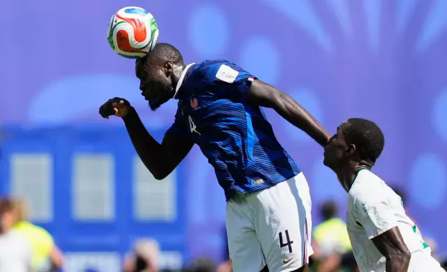 France's Dayot Upamecano heads the ball above Senegal's Nicolas Jackson during the World Cup Group I soccer match between France and Senegal in East Rutherford, N.J., near New York, Tuesday, June 16, 2026. (AP Photo/Yuki Iwamura)