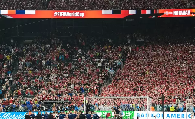 Norway's Martin Oedegaard, right, bangs the drum as he the team salutes fans with a row chant after the World Cup Group I soccer match between Norway and Senegal in East Rutherford, N.J., near New York, Monday, June 22, 2026. (AP Photo/Steve Luciano)