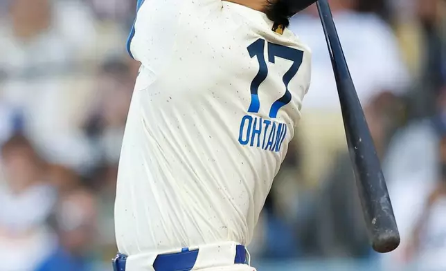 Los Angeles Dodgers designated hitter Shohei Ohtani (17) reacts after hitting a foul ball during the first inning of a baseball game Saturday, June 20, 2026, in Los Angeles. (AP Photo/Caroline Brehman)