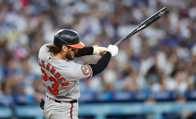 Baltimore Orioles' Blaze Alexander hits a a two-run double during the fourth inning of a baseball game against the Los Angeles Dodgers, Saturday, June 20, 2026, in Los Angeles. (AP Photo/Caroline Brehman)