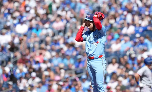 Toronto Blue Jays pitcher Dylan Cease (84) reacts after allowing three walks during first inning of a baseball game against the Texas Rangers, in Toronto, Saturday, June 27, 2026. (Nathan Denette /The Canadian Press via AP)