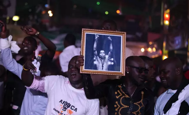 FILE - Afrobeat fans at the New Afrika Shrine in Lagos, Nigeria, Sunday, Oct. 21, 2012. (AP Photo/Sunday Alamba, File)