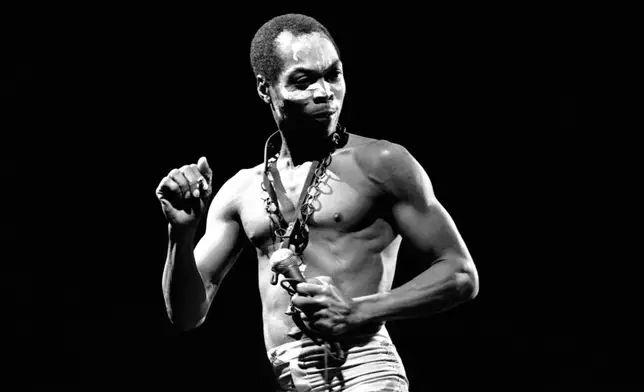 FILE - Nigerian musician and composer Fela Anikulapo Kuti performs at the "Party of Humankind" of the French Communist Party at La Courneuve in Paris, France. Saturday, Sept. 13, 1986. (AP Photo/Laurent Rebours, File)