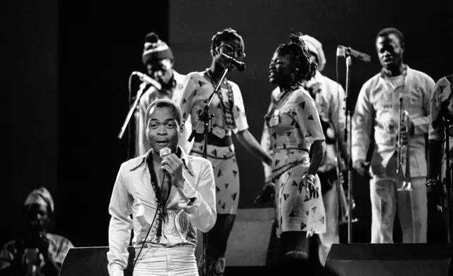 FILE- Nigerian musician and composer Fela Anikulapo Kuti performs with his band at the "Party of Humankind" of the French Communist Party at La Courneuve in Paris, France. Saturday, Sept 13, 1986. (AP Photo/Laurent Rebours, File)
