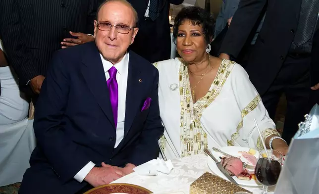 FILE - Clive Davis, left, appears with Aretha Franklin at Aretha's 69th birthday party, in New York, Friday, March 25, 2011. (AP Photo/Charles Sykes, File)