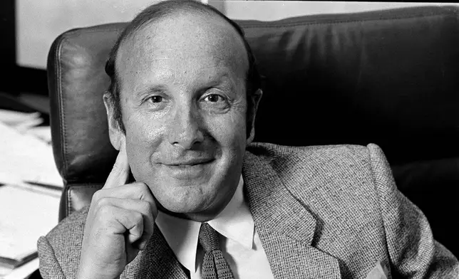 FILE - Record mogul Clive Davis is pictured in his New York office, Sept. 10, 1980. (AP Photo/Marty Reichenthal, File)