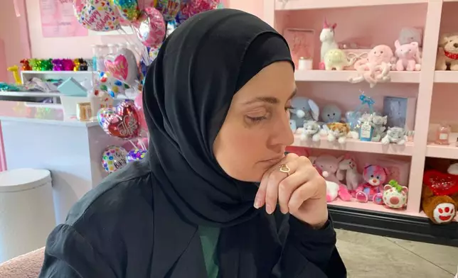 Maya Attoui discusses plans for a fundraiser while seated at a coffee shop on May 29, 2026, in Dearborn, Mich. (AP Photo/Mike Householder)