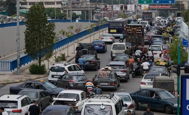 Cars sit in traffic on a highway as residents flee following an Israeli threat to strike Dahiyeh, Beirut's southern suburbs, Lebanon, Monday, June 1, 2026. (AP Photo/Bilal Hussein)