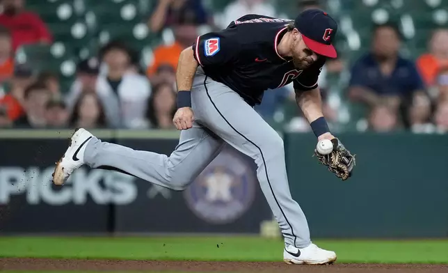 Cleveland Guardians third baseman Daniel Schneemann fields a ground ball hit by Houston Astros' Cam Smith during the fourth inning of a baseball game Saturday, June 20, 2026, in Houston. (AP Photo/Kevin M. Cox)