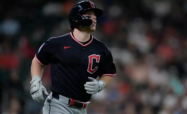Cleveland Guardians' Travis Bazzana runs to first base after hitting an RBI single during the seventh inning of a baseball game against the Houston Astros, Saturday, June 20, 2026, in Houston. (AP Photo/Kevin M. Cox)