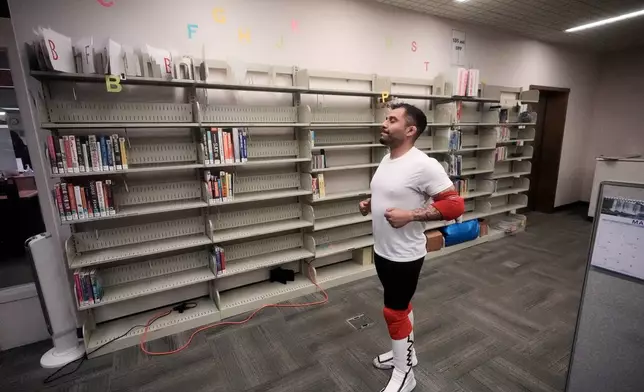 Wrestler Rufio Banderas warms up before a match during a Lucha Libro pro wrestling event at Benicia Public Library Saturday, May 2, 2026, in Benicia, Calif. (AP Photo/Jeff Chiu)