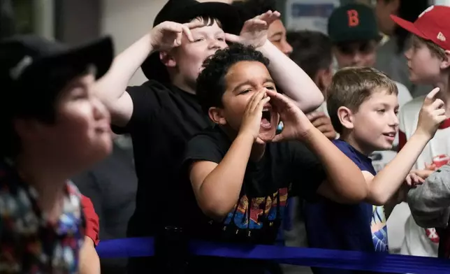 Fans react during a Lucha Libro pro wrestling event at Benicia Public Library Saturday, May 2, 2026, in Benicia, Calif. (AP Photo/Jeff Chiu)