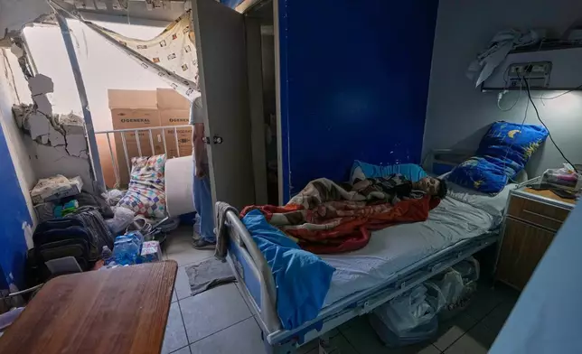 A sick boy lies in a damaged room in the Jabal Amel Hospital, following Monday's Israeli airstrike that hit a nearby building, in the southern port city of Tyre, Lebanon, Tuesday, June 2, 2026. (AP Photo/Mohammed Zaatari)