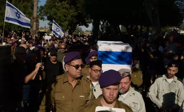 Israeli soldiers carry the coffin of Staff-Sergeant Michael Tyukin, who was killed in a drone attack in southern Lebanon, during his funeral in Ashkelon, Israel, Monday, June 1, 2026. (AP Photo/Leo Correa)