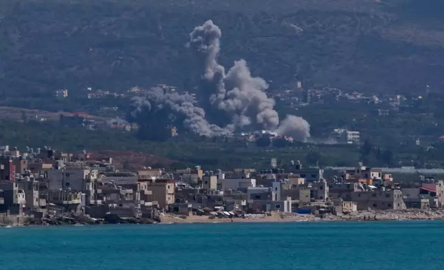 Smoke rises from an Israeli airstrike that hit Qlaileh village, as it seen from the southern port city of Tyre, Lebanon, Tuesday, June 2, 2026. (AP Photo/Mohammed Zaatari)