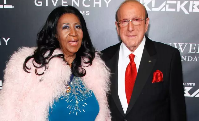 FILE - Aretha Franklin, left, and Clive Davis, attend Keep a Child Alive's 2014 Black Ball in New York on Oct. 30, 2014. (Photo by Andy Kropa/Invision/AP, File)