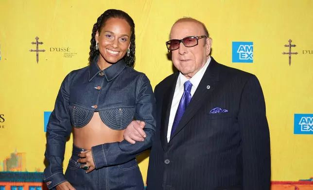 FILE - Alicia Keys, left, and Clive Davis attend the "Hell's Kitchen" Broadway musical opening night performance in New York on April 20, 2024. (Photo by CJ Rivera/Invision/AP, File)