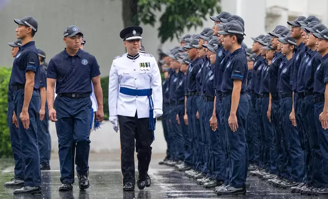 Commissioner of Police inspects passing-out parade of Police Cadet Training  Source: HKSAR Government Press Releases