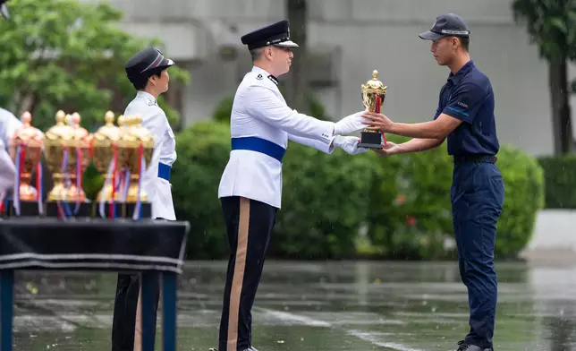 Commissioner of Police inspects passing-out parade of Police Cadet Training  Source: HKSAR Government Press Releases