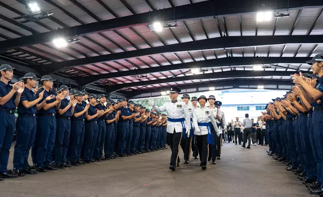 Commissioner of Police inspects passing-out parade of Police Cadet Training  Source: HKSAR Government Press Releases