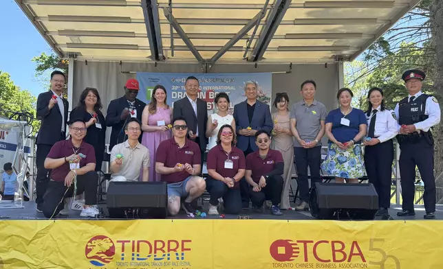 The Director of the Hong Kong Economic and Trade Office (Toronto), Mr Bill Wong (back row, fourth right), officiates at the opening ceremony of the 38th Toronto International Dragon Boat Festival with guests from three levels of government, business sectors and communities on the Centre Island in Toronto, Canada, on June 13 (Toronto time). Source: HKSAR Government Press Releases