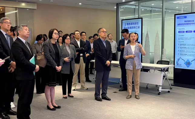 The Secretary for Financial Services and the Treasury, Mr Christopher Hui, and the financial delegation arrived in Shanghai and visited the Shanghai Pudong Service Center for Overseas Investment yesterday (June 17). Photo shows Mr Hui (front row, second right); the Permanent Secretary for Financial Services and the Treasury (Financial Services), Mrs Angelina Cheung (front row, third left); the Director-General of Investment Promotion of Invest Hong Kong, Ms Alpha Lau (front row, third right); the Director-General of the Office for Attracting Strategic Enterprises, Mr Peter Yan (front row, first left), and members of the delegation being given an introduction to the Shanghai Desk. Source: HKSAR Government Press Releases