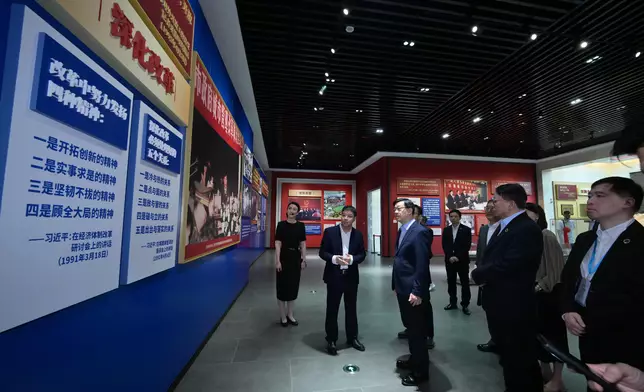 The Chief Executive, Mr John Lee, visited the 30th Anniversary Achievement Exhibition of "3820" Strategic Project in Fujian today (June 24). Photo shows Mr Lee (third left) touring the exhibition. Source: HKSAR Government Press Releases