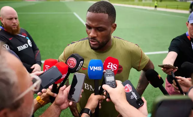 Canada's Cyle Larin speaks to media during a World Cup soccer training session in Toronto, Tuesday, June 9, 2026. (Sammy Kogan/The Canadian Press via AP)