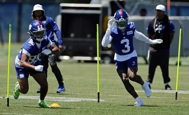 New York Giants wide receiver Odell Beckham Jr. (3) runs drills next to wide receiver Xavier Gipson (88) during an NFL football practice Wednesday, June 3, 2026, in East Rutherford, N.J. (AP Photo/Adam Hunger)
