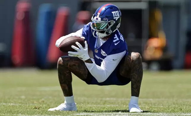New York Giants wide receiver Odell Beckham Jr. (3) makes a catch during an NFL football practice Wednesday, June 3, 2026, in East Rutherford, N.J. (AP Photo/Adam Hunger)