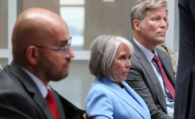 New Mexico Gov. Michelle Lujan Grisham listens to reporters' questions during a news conference in Albuquerque, on Monday, June 29, 2026. (AP Photo/Susan Montoya Bryan)