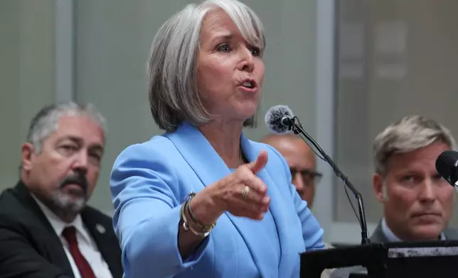 New Mexico Gov. Michelle Lujan Grisham speaks about holding federal authorities accountable for policies that allowed fentanyl pills to reach the streets, during a news conference in Albuquerque, on Monday, June 29, 2026. (AP Photo/Susan Montoya Bryan)